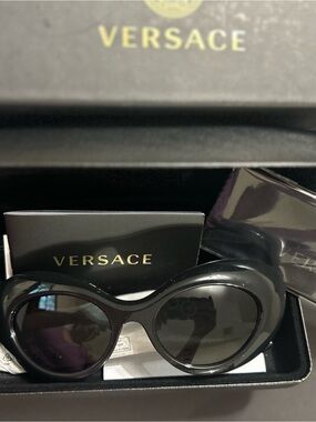 Versace Women’s Black Oval Sunglasses with Dark Lenses